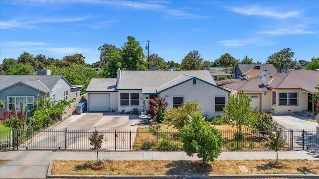4832 E Illinois Ave, Fresno, CA 93727 - ranch-style house with driveway, a garage, a residential view, and a fenced front yard