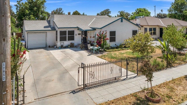 4832 E Illinois Ave, Fresno, CA 93727 - ranch-style home featuring a garage, concrete driveway, stucco siding, a chimney, and roof with shingles