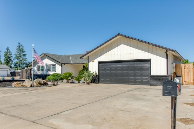 1580 Armstrong Ave, Clovis, CA 93611 - ranch-style house with an attached garage and concrete driveway