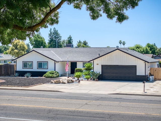 1580 Armstrong Ave, Clovis, CA 93611 - ranch-style house featuring a garage, driveway, and roof with shingles