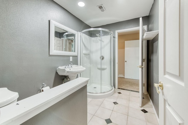 1580 Armstrong Ave, Clovis, CA 93611 - bathroom with a stall shower and tile patterned flooring