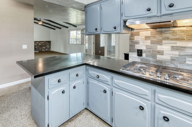 1580 Armstrong Ave, Clovis, CA 93611 - kitchen featuring dark countertops, backsplash, dark aggregate flooring, and under cabinet range hood