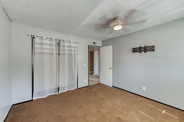 1580 Armstrong Ave, Clovis, CA 93611 - unfurnished bedroom with carpet flooring, a closet, a ceiling fan, and a textured ceiling
