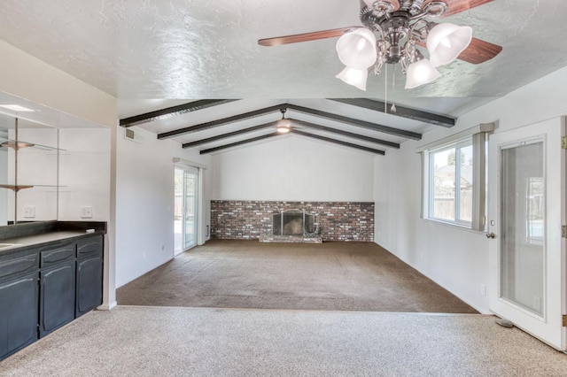 1580 Armstrong Ave, Clovis, CA 93611 - unfurnished living room with carpet floors, a ceiling fan, a textured ceiling, and a brick fireplace
