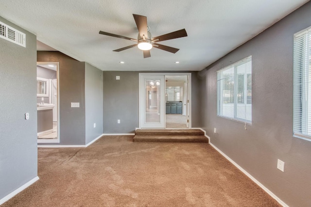 1580 Armstrong Ave, Clovis, CA 93611 - carpeted spare room featuring a ceiling fan and recessed lighting