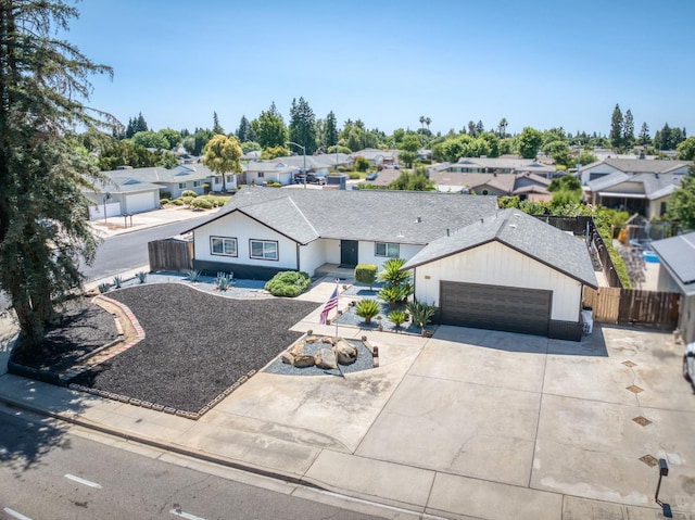1580 Armstrong Ave, Clovis, CA 93611 - ranch-style house featuring a residential view, driveway, a garage, and a shingled roof