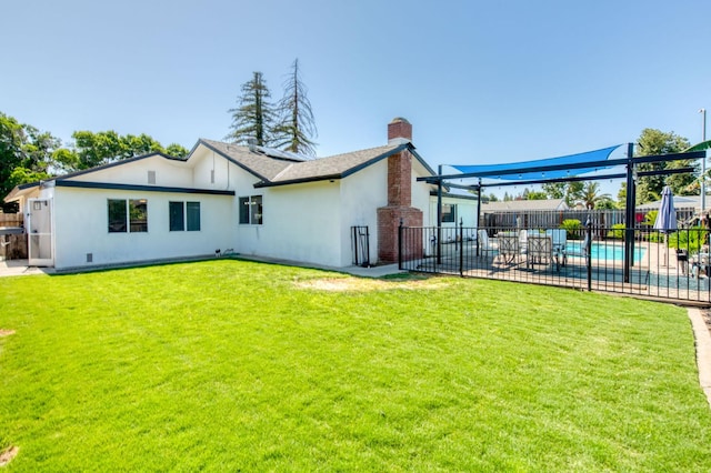 1580 Armstrong Ave, Clovis, CA 93611 - back of house featuring a fenced backyard, a chimney, stucco siding, and a patio area