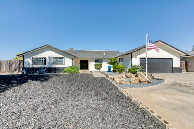 1580 Armstrong Ave, Clovis, CA 93611 - ranch-style home with an attached garage and driveway