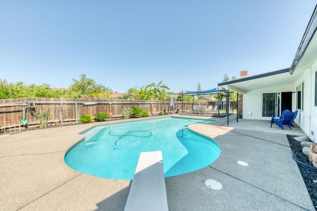 1580 Armstrong Ave, Clovis, CA 93611 - view of pool featuring a patio area, a diving board, and a fenced backyard