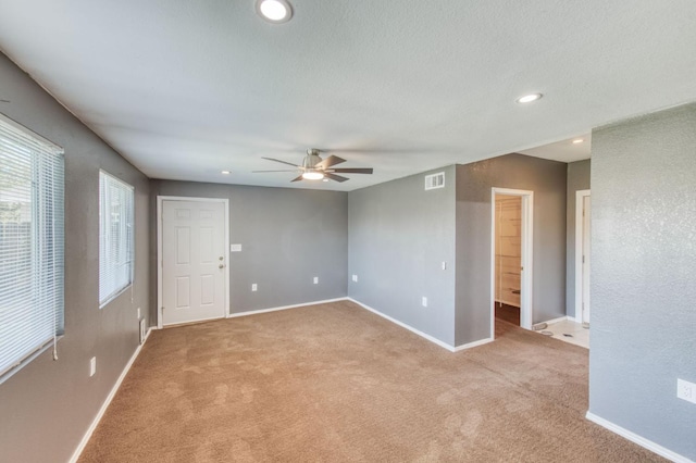 1580 Armstrong Ave, Clovis, CA 93611 - empty room featuring a ceiling fan, light colored carpet, and recessed lighting