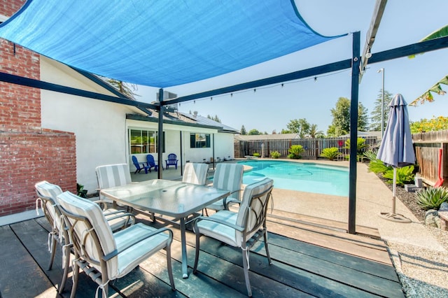 1580 Armstrong Ave, Clovis, CA 93611 - view of swimming pool with a fenced backyard, outdoor dining area, and a patio area