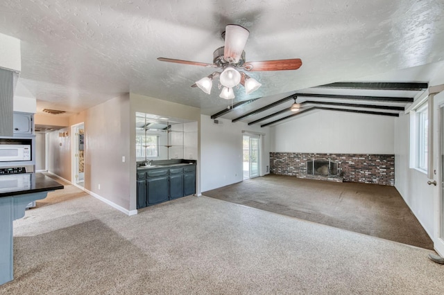 1580 Armstrong Ave, Clovis, CA 93611 - unfurnished living room featuring a textured ceiling, carpet floors, and a ceiling fan