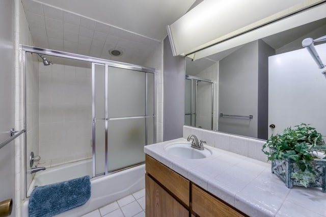 5039 N Van Ness Blvd, Fresno, CA 93711 - full bathroom featuring bath / shower combo with glass door, vanity, and tile patterned floors