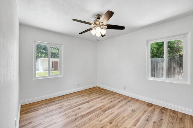 4611 N Safford Ave, Fresno, CA 93704 - empty room with light wood finished floors and a ceiling fan