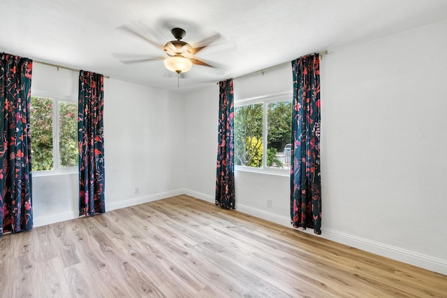 4611 N Safford Ave, Fresno, CA 93704 - empty room with wood finished floors, healthy amount of natural light, and ceiling fan