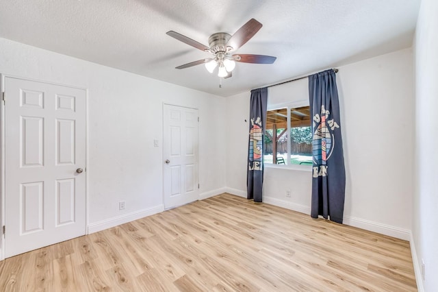 4611 N Safford Ave, Fresno, CA 93704 - unfurnished room featuring wood finished floors, ceiling fan, and a textured ceiling