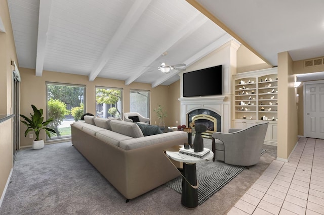 3547 W Locust Ave, Fresno, CA 93711 - living area featuring a glass covered fireplace, a ceiling fan, light tile patterned floors, and light colored carpet