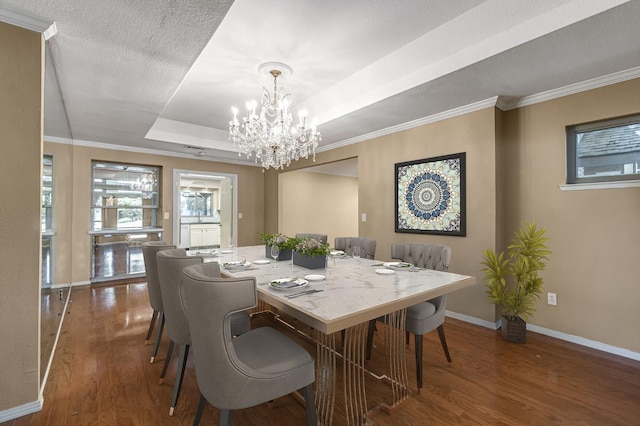 3547 W Locust Ave, Fresno, CA 93711 - dining space featuring wood finished floors, a chandelier, a tray ceiling, and an office area