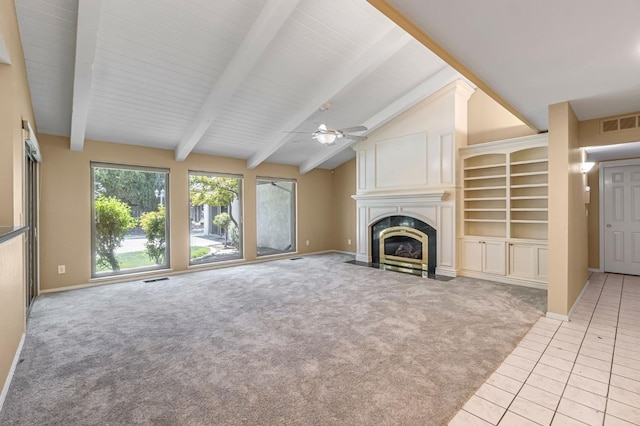 3547 W Locust Ave, Fresno, CA 93711 - unfurnished living room with light carpet, ceiling fan, a fireplace with flush hearth, and light tile patterned floors