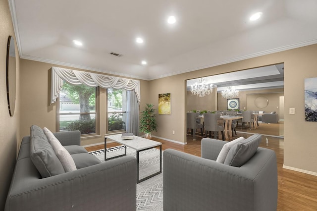 3547 W Locust Ave, Fresno, CA 93711 - living room featuring crown molding, a chandelier, light wood-type flooring, and recessed lighting