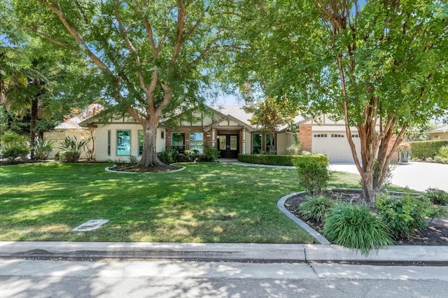 3547 W Locust Ave, Fresno, CA 93711 - view of front of property with french doors, a garage, and a front yard