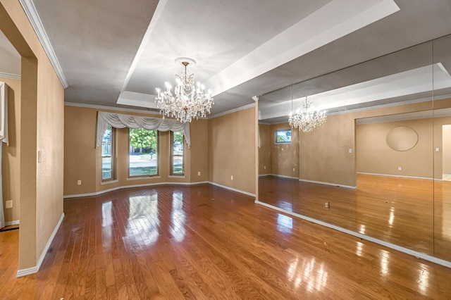 3547 W Locust Ave, Fresno, CA 93711 - unfurnished room featuring a chandelier, a raised ceiling, hardwood / wood-style flooring, and ornamental molding