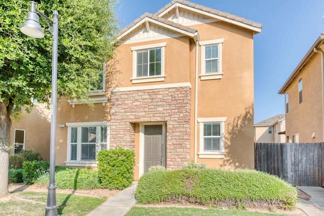5516 N Sebastian Ln, Fresno, CA 93722 - traditional-style house featuring stone siding and stucco siding
