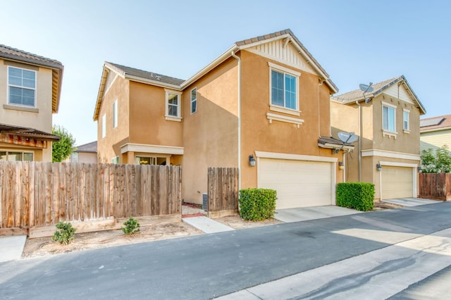 5516 N Sebastian Ln, Fresno, CA 93722 - view of front of property featuring stucco siding and an attached garage