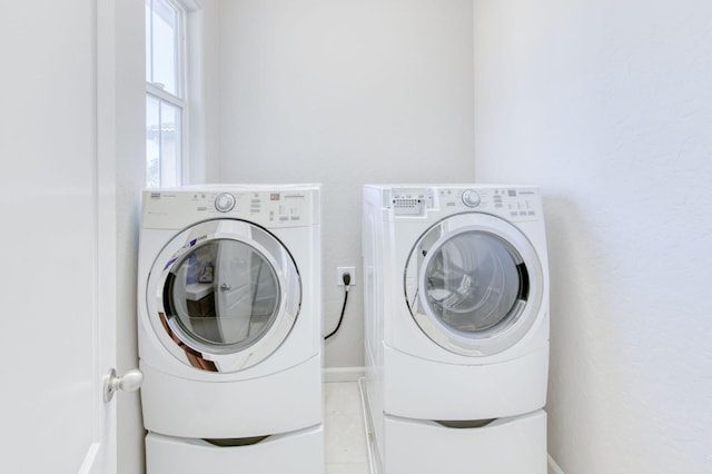 5516 N Sebastian Ln, Fresno, CA 93722 - laundry area with independent washer and dryer and light tile patterned floors