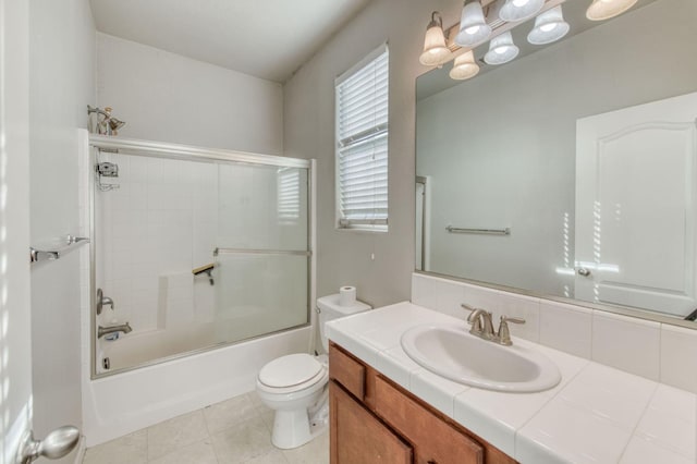 5516 N Sebastian Ln, Fresno, CA 93722 - full bath with vanity, bath / shower combo with glass door, and tile patterned floors
