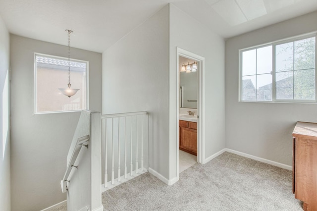 5516 N Sebastian Ln, Fresno, CA 93722 - corridor featuring an upstairs landing and light carpet