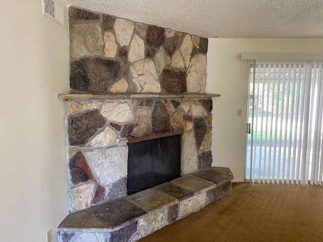 4902 E Townsend Ave, Fresno, CA 93727 - detailed view of carpet floors, a textured ceiling, and a stone fireplace