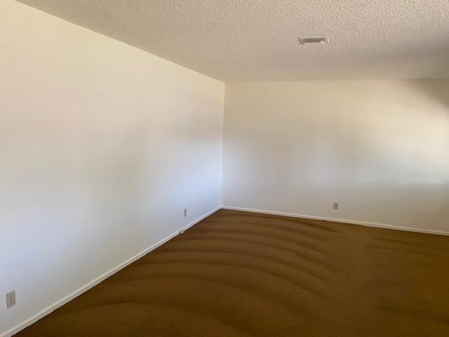 4902 E Townsend Ave, Fresno, CA 93727 - spare room featuring carpet flooring