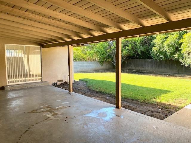 4902 E Townsend Ave, Fresno, CA 93727 - fenced backyard with a patio
