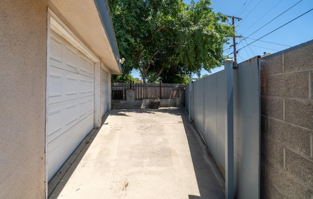 1711 W Weldon, Fresno, CA 93705 - view of side of home featuring a garage