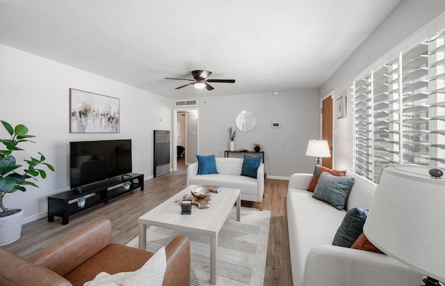 1711 W Weldon, Fresno, CA 93705 - living room with light wood-style floors and a ceiling fan