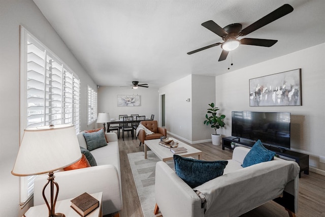1711 W Weldon, Fresno, CA 93705 - living room featuring a ceiling fan and wood finished floors