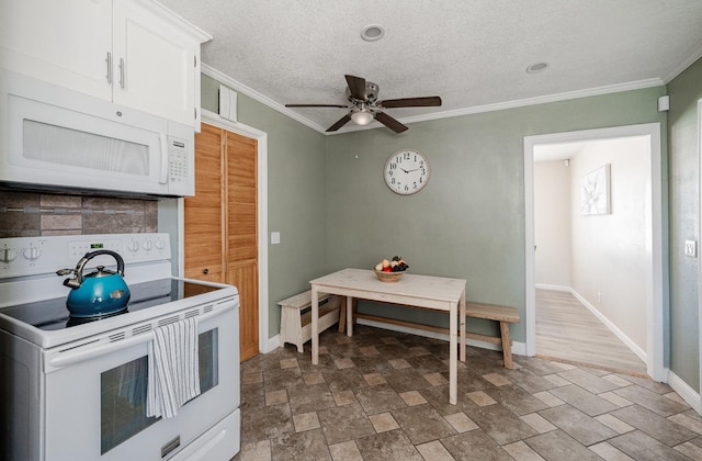 1711 W Weldon, Fresno, CA 93705 - kitchen featuring white appliances, a ceiling fan, ornamental molding, white cabinetry, and stone finish flooring