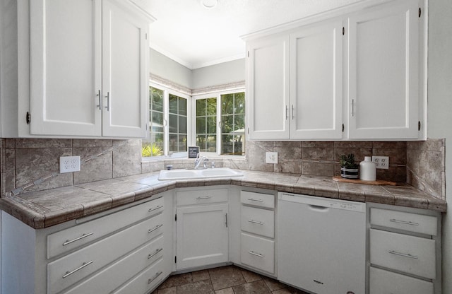 1711 W Weldon, Fresno, CA 93705 - kitchen featuring dishwasher, white cabinets, backsplash, ornamental molding, and tile counters