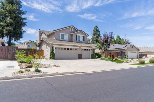 2518 Keats Ave, Fresno, CA 93611 - traditional-style home with concrete driveway and an attached garage