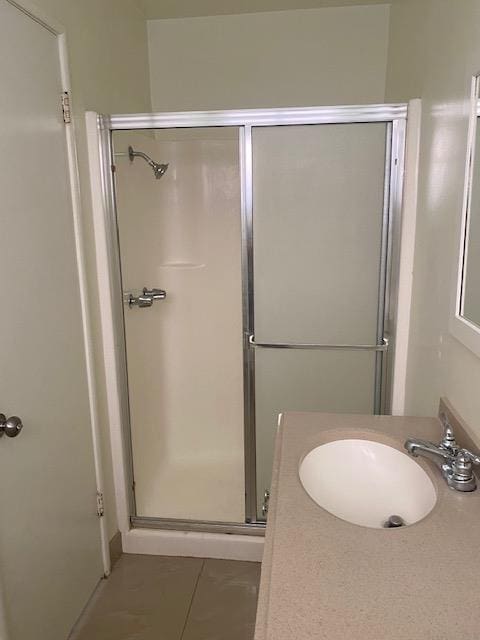 2739 Fine Ave, Clovis, CA 93612 - full bathroom featuring a shower stall, vanity, and tile patterned floors