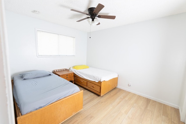 2739 Fine Ave, Clovis, CA 93612 - bedroom with light wood finished floors and ceiling fan