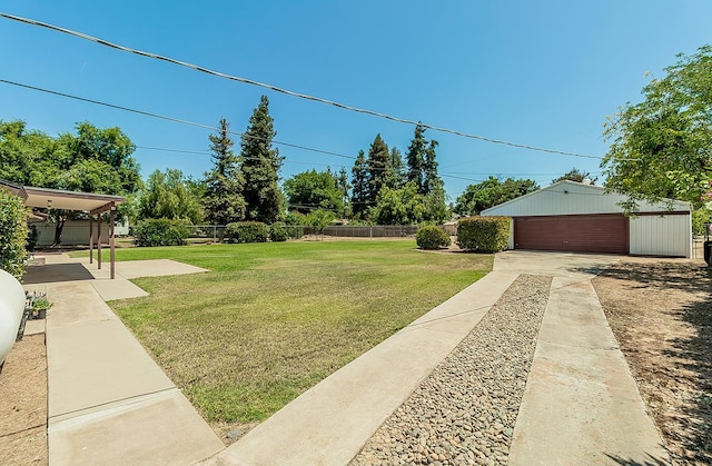 11851 Waverly Rd, Madera, CA 93636 - view of yard featuring a garage and an outbuilding