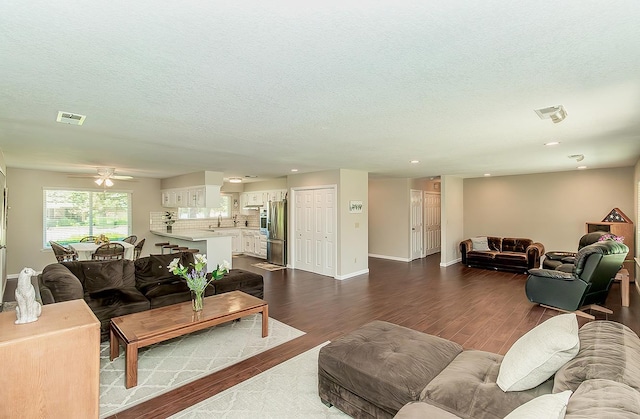11851 Waverly Rd, Madera, CA 93636 - living area featuring dark wood-style floors, a textured ceiling, ceiling fan, and recessed lighting