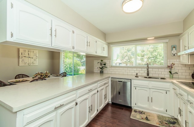 11851 Waverly Rd, Madera, CA 93636 - kitchen featuring stainless steel dishwasher, a peninsula, white cabinets, backsplash, and light countertops