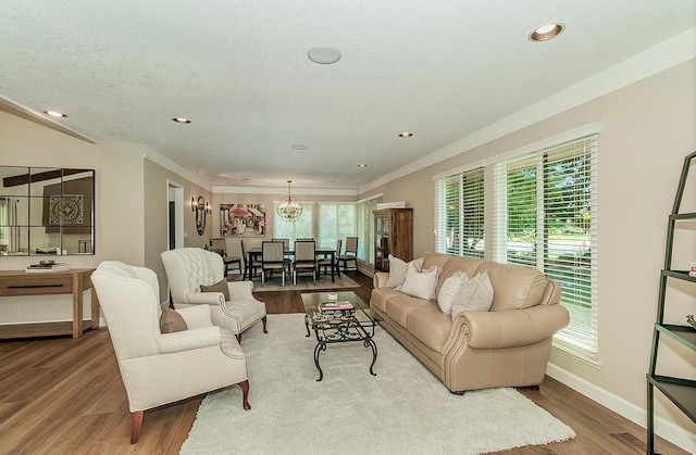 5383 N Briarwood Ave, Fresno, CA 93711 - living room featuring wood finished floors, recessed lighting, a chandelier, crown molding, and a textured ceiling