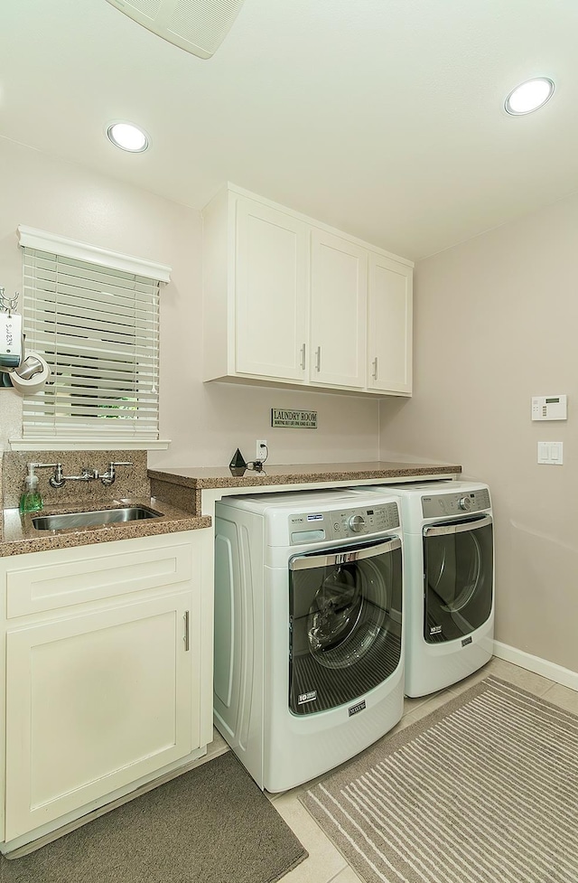 5383 N Briarwood Ave, Fresno, CA 93711 - laundry room with washing machine and clothes dryer, cabinet space, light tile patterned floors, and recessed lighting