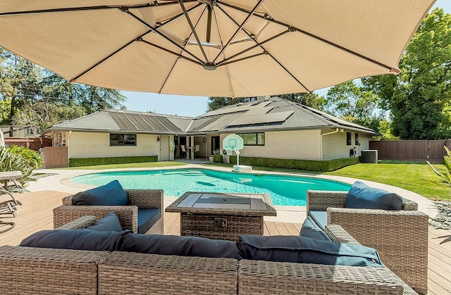 5383 N Briarwood Ave, Fresno, CA 93711 - view of swimming pool with outdoor lounge area, a deck, and a fenced backyard