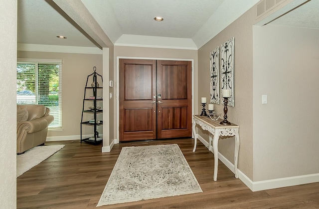5383 N Briarwood Ave, Fresno, CA 93711 - entryway featuring dark wood finished floors, ornamental molding, and a textured ceiling