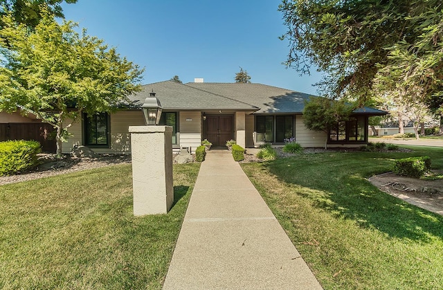 5383 N Briarwood Ave, Fresno, CA 93711 - view of front of home featuring a front yard and a shingled roof